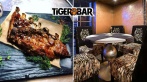 Скидка 50% на меню и напитки в рестобаре Tiger Bar на канале Грибоедова, 7. Пинчос с креветкой 90 р., стейки от 270 р., пенное от 100 р., коктейли с градусом от 150 р.